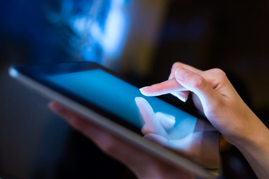 Hand using a tablet Hand using a tablet